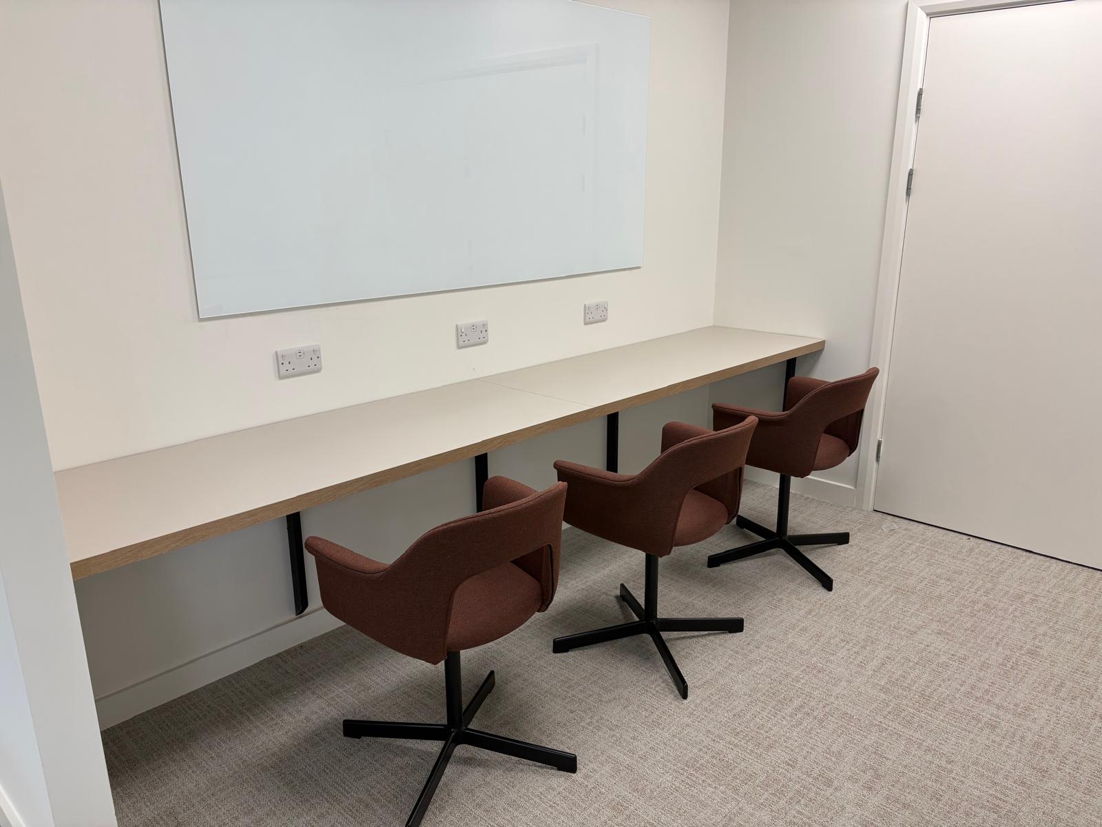 Workplace counter with power outlets positioned above the work surface